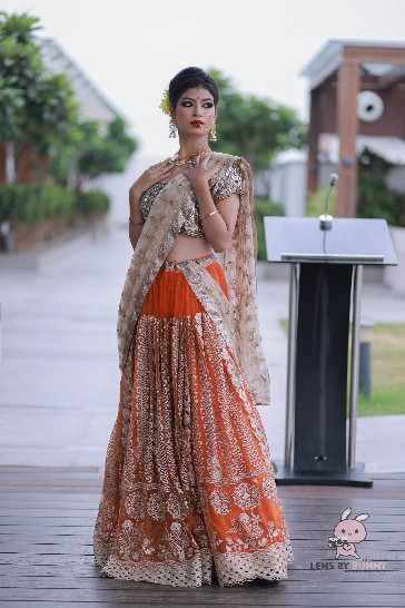 Orange Bridal Lehenga with Heavy Embroidered Dupatta & Silver Blouse